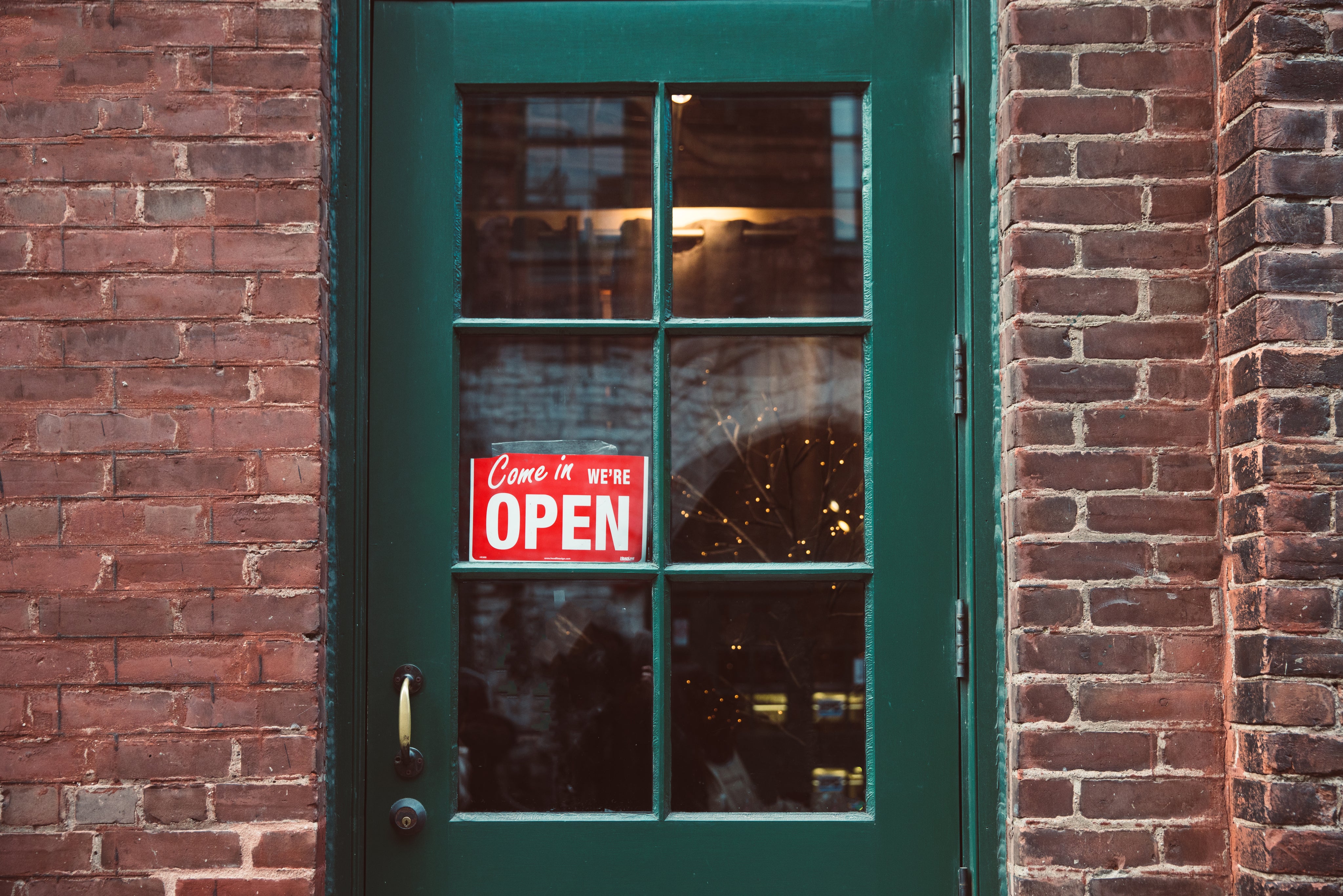 green-door-with-open-sign
