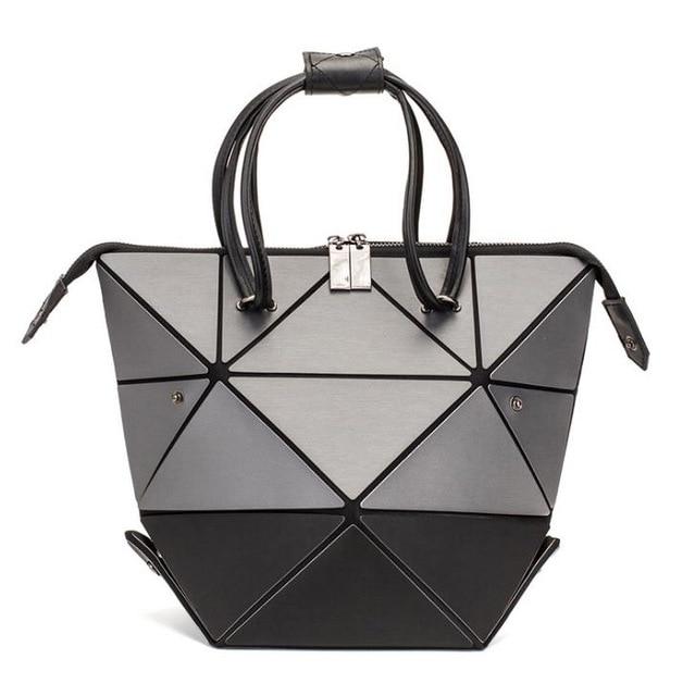 Reflektinė-spalvas-keičianti-rankinė-'4 viename'