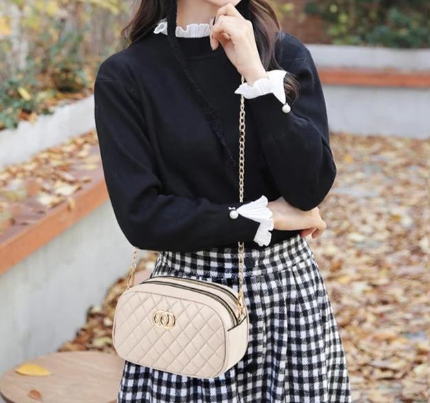 Rankinė-per-petį-Meina